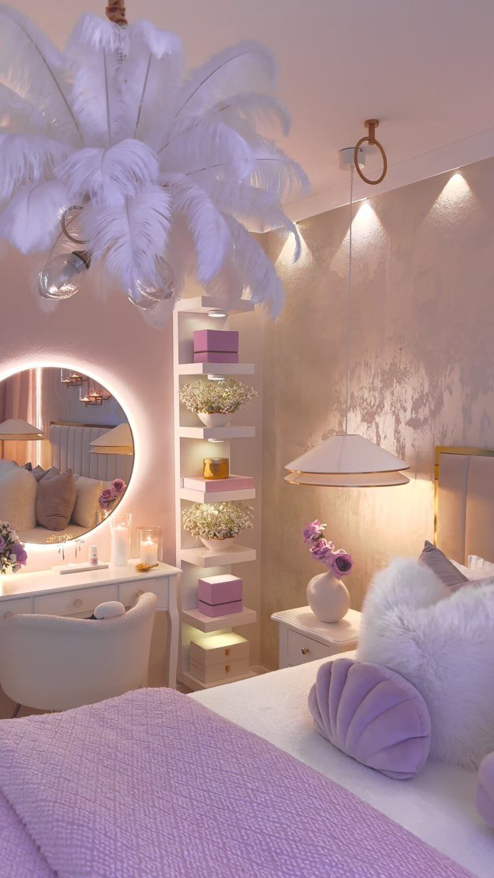 Luxurious bedroom with purple bedding, white faux-fur accents, and a large feather chandelier.