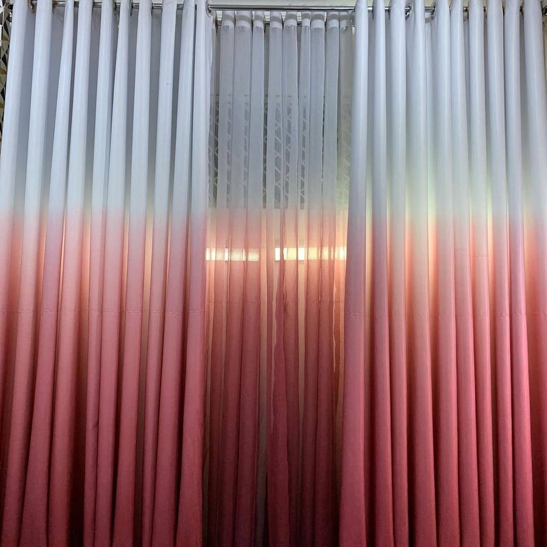 Ombre curtains fading from white at the top to pink at the bottom.