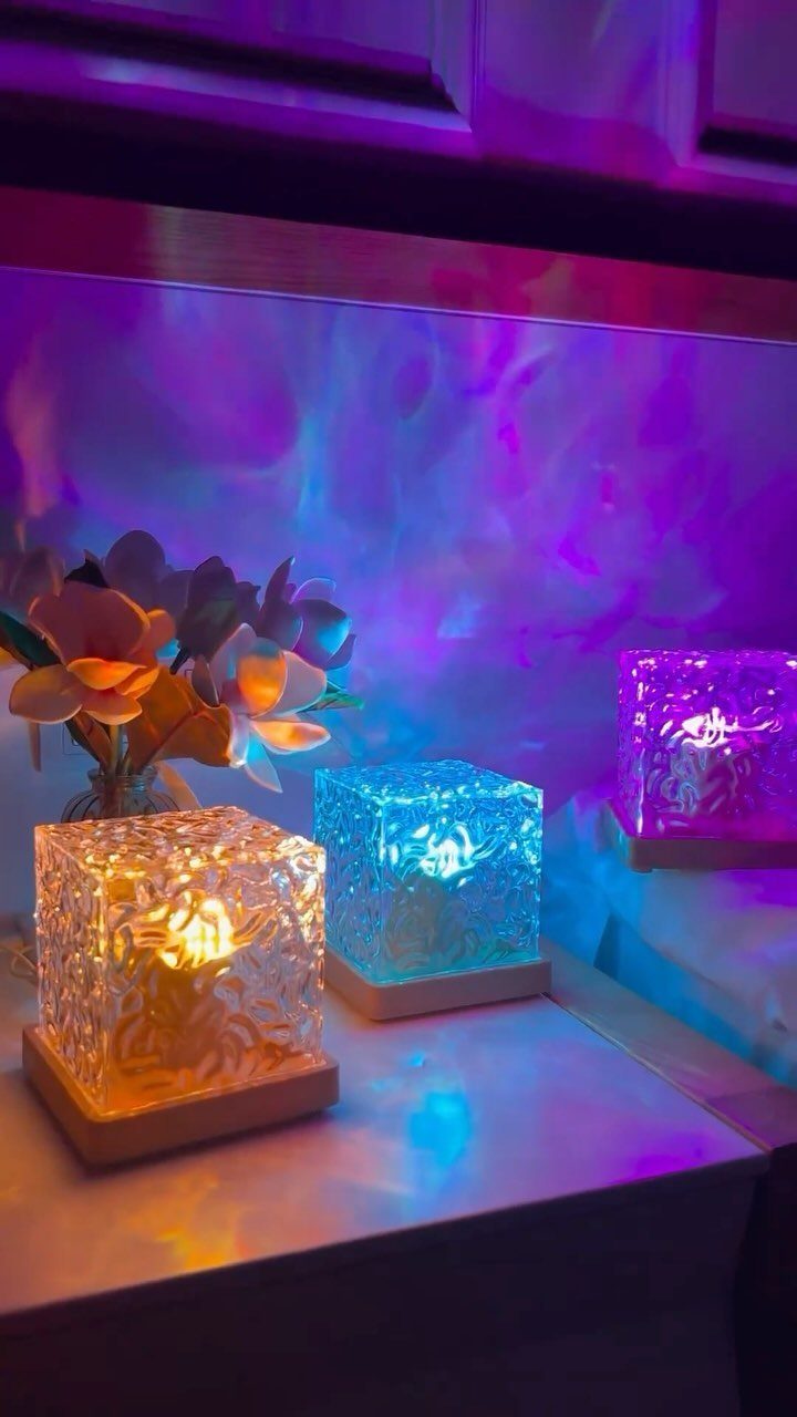 DIY LED Light Lamp Ideas: 27 Backlights, Pendants, Table Lamps 7 Three square LED lamps with textured covers and wooden bases glowing in different colors.