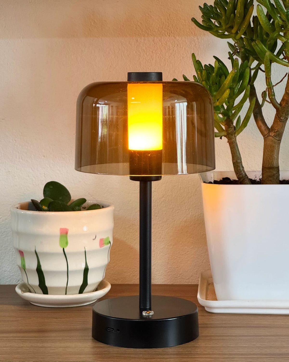 DIY LED Light Lamp Ideas: 27 Backlights, Pendants, Table Lamps 8 Modern black LED lamp with a brown glass lampshade and warm yellow light.