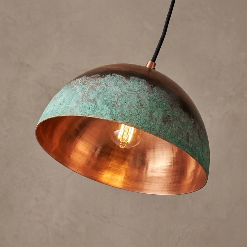 DIY LED Light Lamp Ideas: 27 Backlights, Pendants, Table Lamps 19 Dome pendant lamp with green patina exterior and glowing copper interior against beige wall