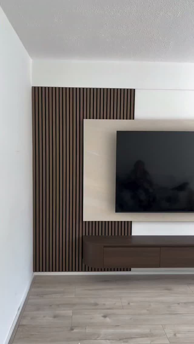 Floating Shelf Under TV Ideas: 31 Styles for Living Rooms 20 Dark wood floating shelf mounted under a television on a slatted wall.