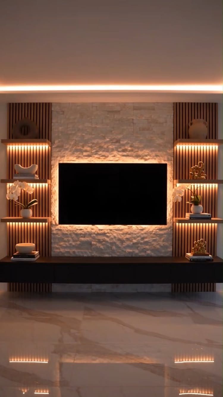 Floating Shelf Under TV Ideas: 31 Styles for Living Rooms 26 Modern TV wall with white stone center, wood slat sides, and dark floating console.
