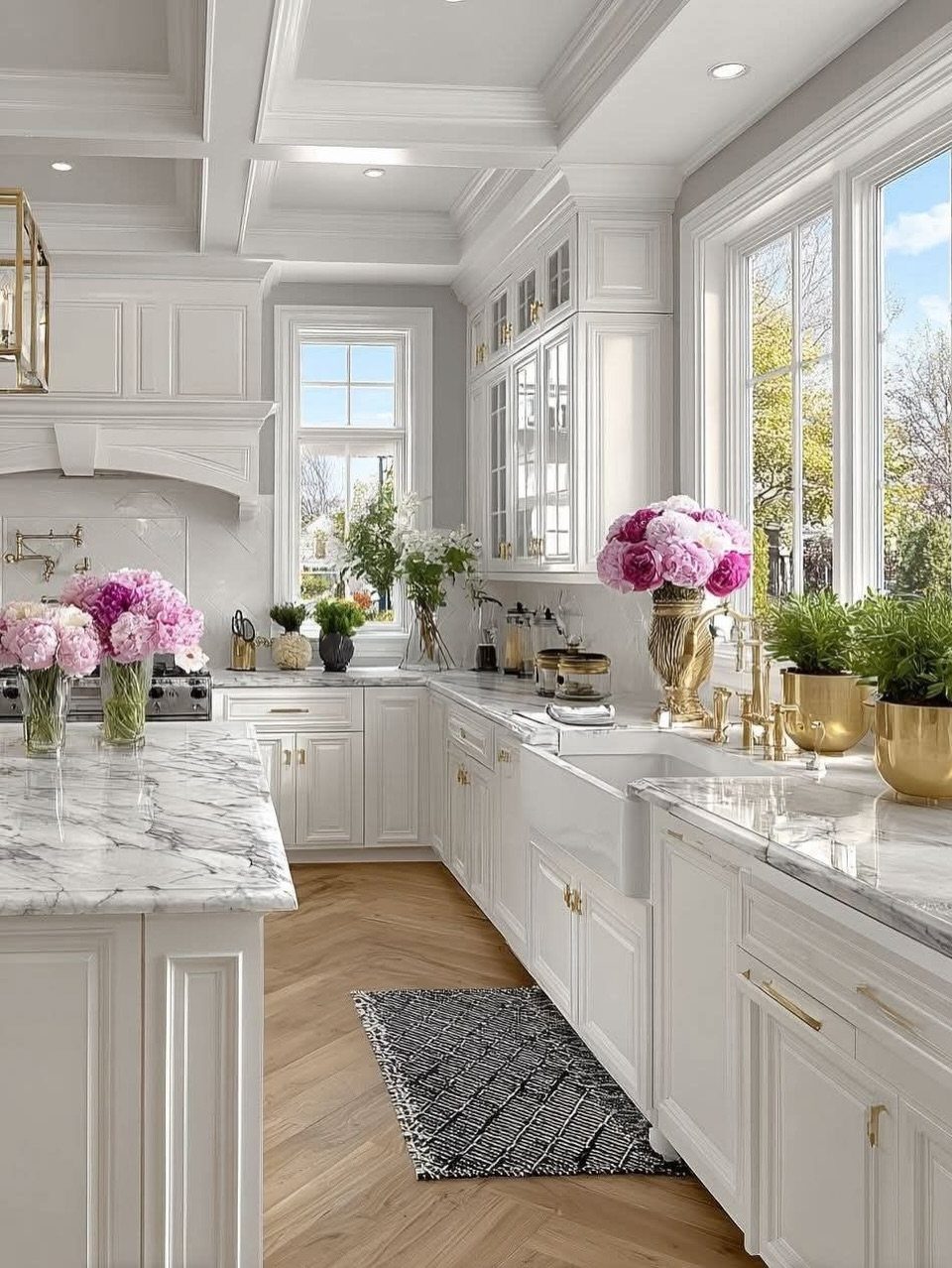 13 Kitchen Island Back Panel Ideas, From Beadboard to Stone 1 White kitchen island with applied molding panels and marble countertop in bright room