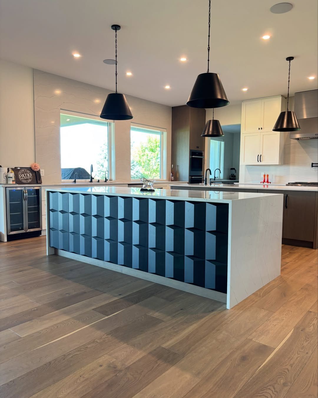 13 Kitchen Island Back Panel Ideas, From Beadboard to Stone 9 Modern kitchen island with a dark blue 3D geometric patterned back panel.