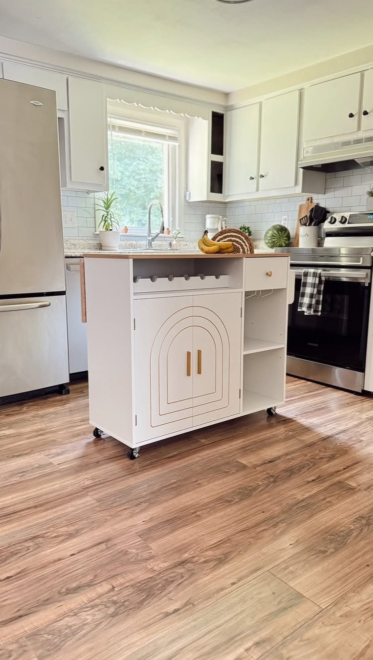 13 Kitchen Island Back Panel Ideas, From Beadboard to Stone 4 White mobile kitchen island with arched cabinet doors and open side shelving.
