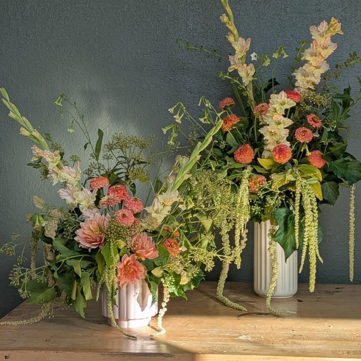 Large Floral Centerpieces: 5 Ideas for Tables and Seasons 2 Two tall floral centerpieces with gladiolas and dahlias in white ribbed vases.
