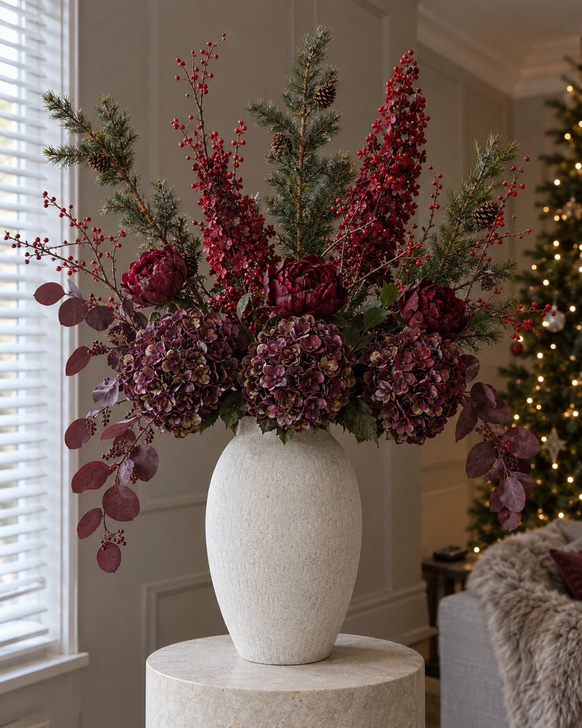 Large Floral Centerpieces: 5 Ideas for Tables and Seasons 5 Winter berry arrangement with red peonies and purple hydrangeas in a white vase.