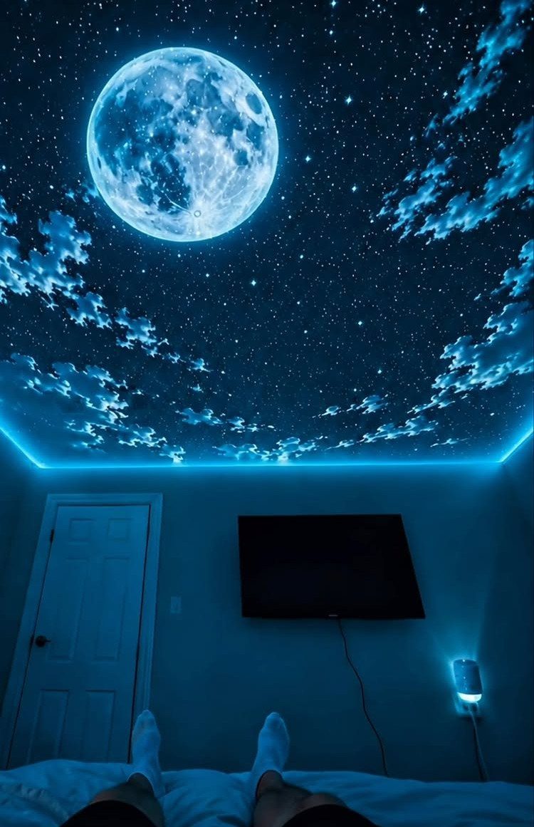 Lights for Room Decoration: 12 Ideas for Every Style in 2026 10 Bedroom ceiling with a blue galaxy projector showing a moon and stars.