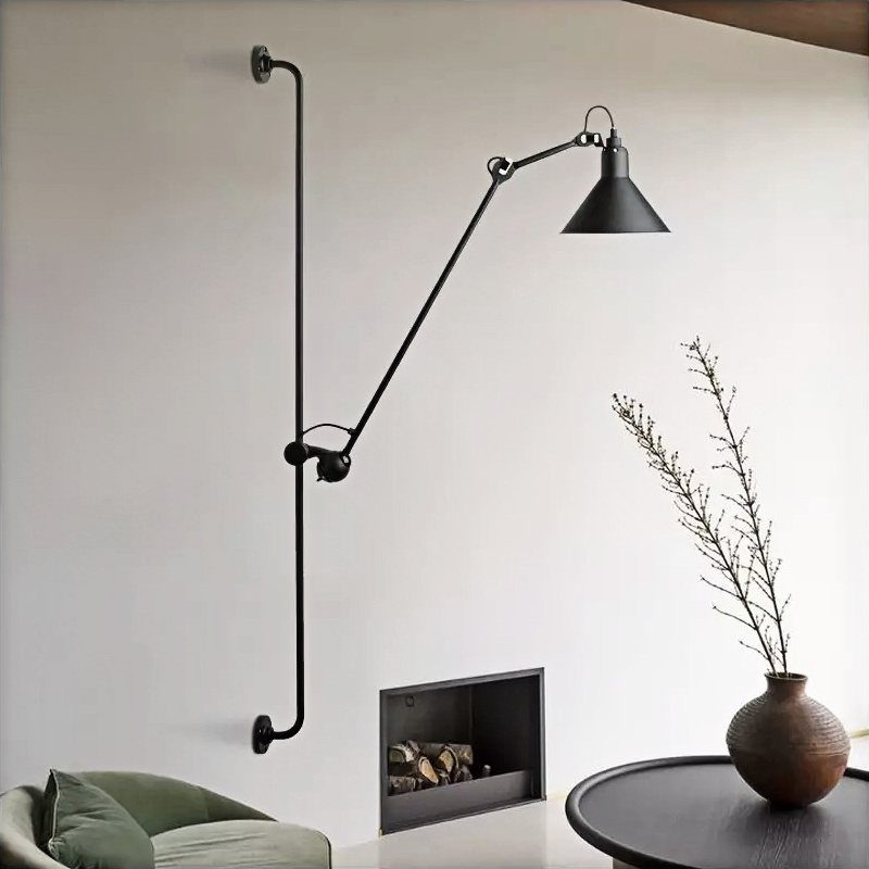 Lights for Room Decoration: 12 Ideas for Every Style in 2026 7 Black adjustable swingarm wall lamp mounted on a white wall above a side table.
