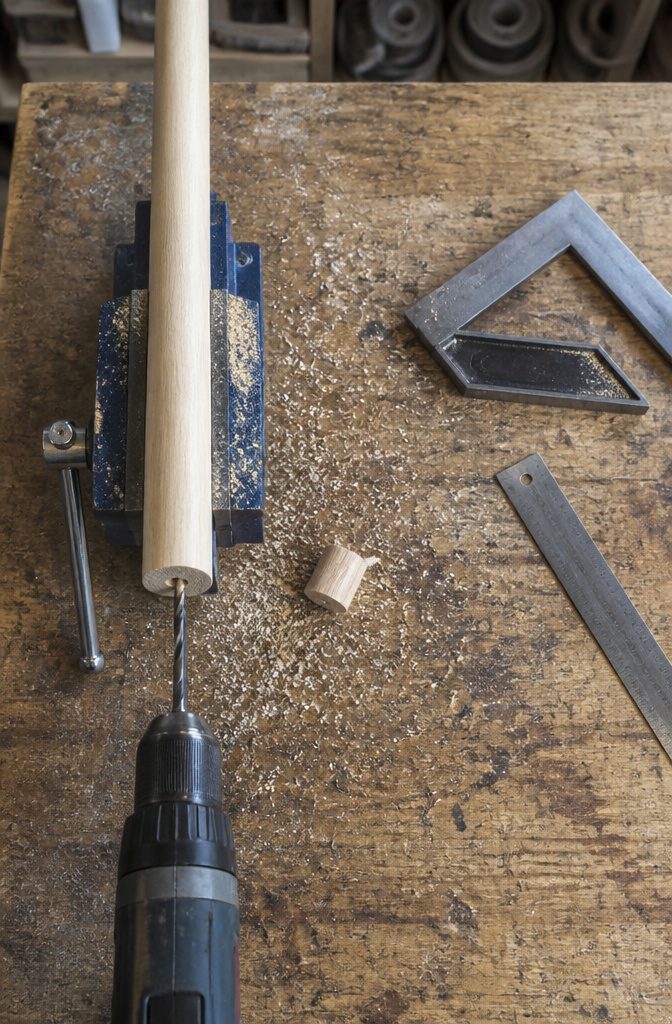 Closet-rod dowel with a centered hole and a short cut piece