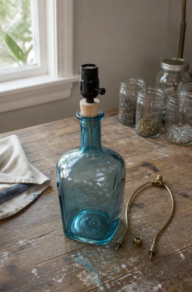 Socket base seated in a short dowel above a heavy bottle