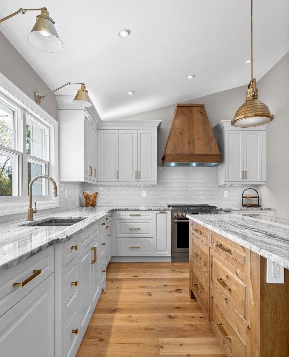 Modern Kitchen Hood Ideas: 12 Designs from Metal to Minimalist 9 Wooden range hood installed under a sloped ceiling in a modern white kitchen.