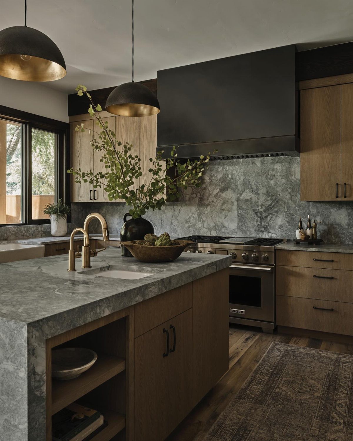 Modern Kitchen Hood Ideas: 12 Designs from Metal to Minimalist 2 Matte black metal range hood in a modern kitchen with marble countertops.