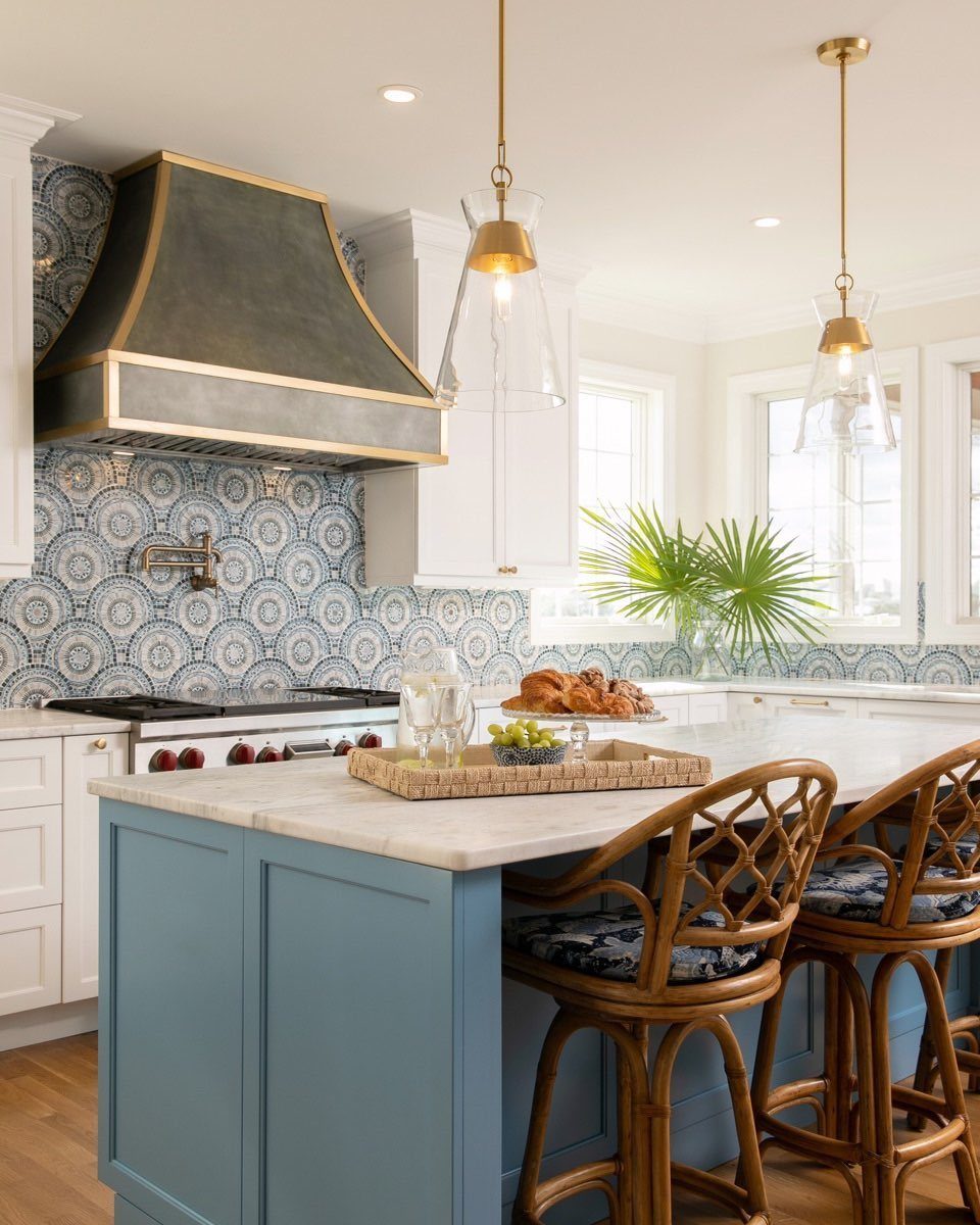 Modern Kitchen Hood Ideas: 12 Designs from Metal to Minimalist 8 Dark grey range hood with brass accent straps in a bright modern kitchen.