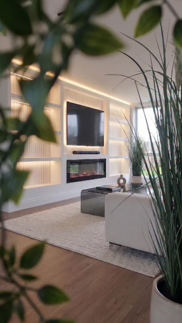 39 TV Design Ideas, from Built-In Shelving to Fireplace Walls 11 All-white built-in TV wall with integrated shelving and a modern linear fireplace.