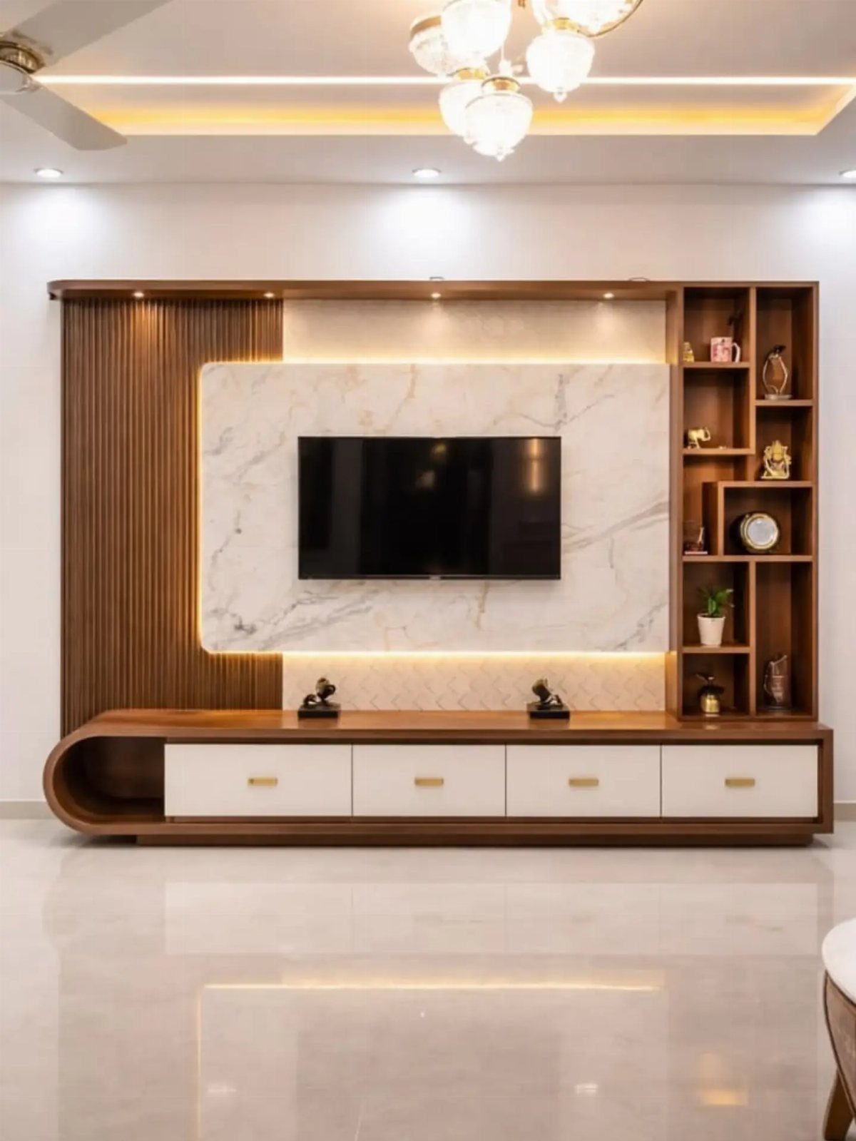 39 TV Design Ideas, from Built-In Shelving to Fireplace Walls 35 Modern TV wall unit with marble backdrop, wood paneling, and integrated shelving.
