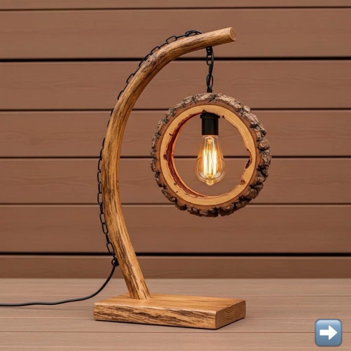 Wooden table lamp with a curved branch and an exposed Edison bulb inside a wood slice.