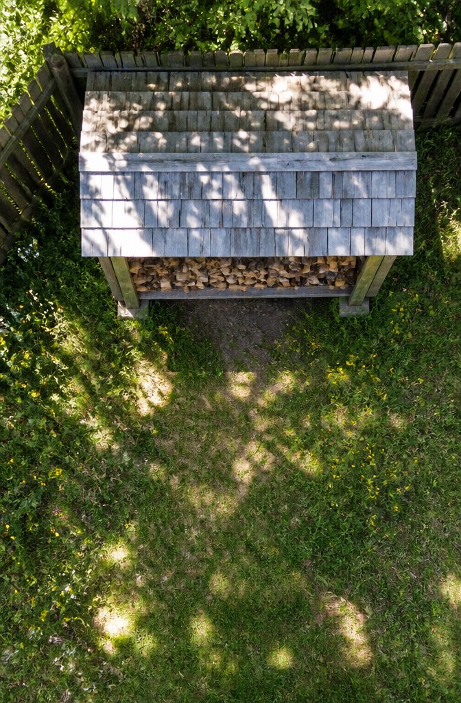 20 Wood Shed Ideas for Backyard Storage in 2026 7 DIY firewood shed framed with 2x4s and cedar pickets.