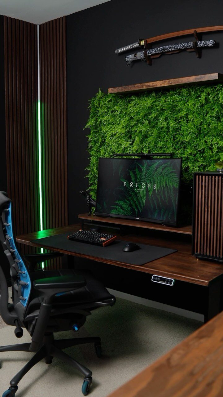 Wood Slat Wall with Shelves: 10 Ideas for Plants, TVs, Desks 2 Home office with a green moss plant wall, wooden shelf, and vertical wood slats.